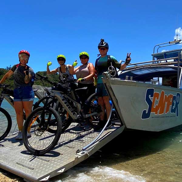 Guests arriving on boat transfer with bikes